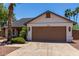 Inviting single-level home featuring desert landscaping, a two-car garage, and a well-kept front yard at 723 E Piute Ave, Phoenix, AZ 85024