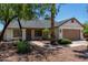 Charming house with a well maintained lawn, desert landscaping, and an attached two-car garage at 723 E Piute Ave, Phoenix, AZ 85024