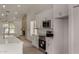 A bright kitchen with stainless appliances, gas range, and breakfast bar at 723 E Piute Ave, Phoenix, AZ 85024