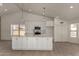 An open kitchen concept with a kitchen island, stainless appliances, and plenty of cabinet space at 723 E Piute Ave, Phoenix, AZ 85024