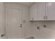 Laundry room features modern cabinets at 723 E Piute Ave, Phoenix, AZ 85024