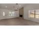 Bright living room with tile flooring, a stone fireplace, and large windows for natural light at 723 E Piute Ave, Phoenix, AZ 85024