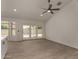Spacious living room featuring neutral tile flooring, ceiling fan, recessed lighting, and sliding glass doors to the backyard at 723 E Piute Ave, Phoenix, AZ 85024