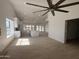 Bright, spacious living room with an open floor plan flowing into an updated kitchen with white cabinets at 723 E Piute Ave, Phoenix, AZ 85024