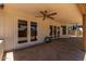 Covered patio featuring ceiling fan and direct access to pool area through white framed glass doors at 723 E Piute Ave, Phoenix, AZ 85024