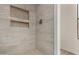 Modern shower featuring stylish tile work, recessed niches and upgraded fixtures at 723 E Piute Ave, Phoenix, AZ 85024