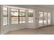 Bright bonus room featuring large windows overlooking the swimming pool and access to the backyard patio at 723 E Piute Ave, Phoenix, AZ 85024