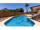 Inviting backyard pool featuring a slide, surrounded by a block fence for privacy at 723 E Piute Ave, Phoenix, AZ 85024