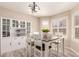 Dining room with a stylish chandelier, and a built-in display cabinet at 7724 W Oraibi Dr, Glendale, AZ 85308