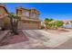 Charming two-story home with desert landscaping, and a two car garage at 7724 W Oraibi Dr, Glendale, AZ 85308