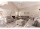 Bright living room featuring vaulted ceilings, fireplace, and neutral decor at 7724 W Oraibi Dr, Glendale, AZ 85308