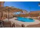 Cool off in your private pool surrounded by lush landscaping, a cozy sitting area, and a large patio at 7724 W Oraibi Dr, Glendale, AZ 85308