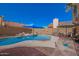 Relax in your backyard around this beautiful pool with a waterfall, mature landscaping, and covered patio at 7724 W Oraibi Dr, Glendale, AZ 85308