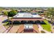 A backyard aerial showing the lush lawn, tiled roof, solar panels, and verdant landscaping at 8043 E Laurel St, Mesa, AZ 85207