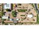 Aerial view of sprawling desert property with various structures and well-kept landscaping at 8043 E Laurel St, Mesa, AZ 85207