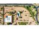 Aerial view of a desert home highlighting the landscaping, pool, and circular driveway at 8043 E Laurel St, Mesa, AZ 85207