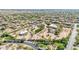 Aerial view of the property featuring an open lot with desert landscaping, mature trees, pool, and guest homes at 8043 E Laurel St, Mesa, AZ 85207