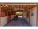 Spacious barn interior with metal framework and ample storage, perfect for equipment and livestock at 8043 E Laurel St, Mesa, AZ 85207