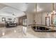 Luxurious primary bath with a tub, arched ceiling, and stained glass windows at 8043 E Laurel St, Mesa, AZ 85207