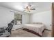 Cozy bedroom with a fan, window, and natural light provides a relaxing space at 8043 E Laurel St, Mesa, AZ 85207