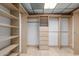 Walk-in closet with built-in shelves and drawers for maximum storage and organization at 8043 E Laurel St, Mesa, AZ 85207