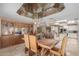 Dining room with wood table, chandelier, view to kitchen at 8043 E Laurel St, Mesa, AZ 85207