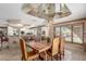 Elegant dining room featuring a large wooden table, seating for six, and a view of the outdoor scenery at 8043 E Laurel St, Mesa, AZ 85207