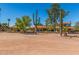 Spacious desert property featuring a hacienda-style home surrounded by mature cacti and native landscaping at 8043 E Laurel St, Mesa, AZ 85207