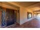 An inviting front entrance with decorative wrought iron door, side windows, and tiled porch at 8043 E Laurel St, Mesa, AZ 85207