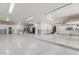 Spacious and bright garage with smooth flooring, multiple lighting fixtures, and ample room for storage at 8043 E Laurel St, Mesa, AZ 85207
