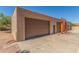 Detached garage with multiple bays, and lift equipment provides ample space for parking and projects at 8043 E Laurel St, Mesa, AZ 85207