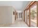 Hallway with lots of natural light and access to the outside at 8043 E Laurel St, Mesa, AZ 85207