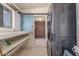 A laundry room features a washer, dryer, storage, and utility sink at 8043 E Laurel St, Mesa, AZ 85207
