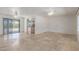 Open living room features tile floors and natural light and offers a great flow into the kitchen at 8043 E Laurel St, Mesa, AZ 85207