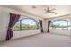Spacious living room featuring arched windows with mountain views at 8043 E Laurel St, Mesa, AZ 85207