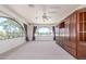 Spacious living room featuring arched windows with view and built-in shelving at 8043 E Laurel St, Mesa, AZ 85207