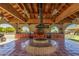 Inviting outdoor kitchen featuring an open fire pit, stainless steel appliances, and ample counter space at 8043 E Laurel St, Mesa, AZ 85207