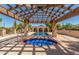 Stunning pool and spa area featuring a covered patio with wood beams and blue tile accents at 8043 E Laurel St, Mesa, AZ 85207