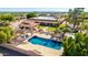 Aerial view of desert home backyard featuring refreshing pool, spa, lush landscape, and outdoor living at 8043 E Laurel St, Mesa, AZ 85207