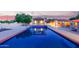Inviting backyard pool featuring a covered patio with beautiful tile design, and well maintained landscaping at 8043 E Laurel St, Mesa, AZ 85207