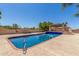 Backyard swimming pool featuring a unique covered patio and a relaxing desert landscape at 8043 E Laurel St, Mesa, AZ 85207