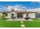 Landscaped backyard showing a patio and lush green lawn, perfect for outdoor living at 8252 E Heatherbrae Ave, Scottsdale, AZ 85251