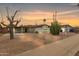 Charming single-story home featuring mature landscaping, a brick driveway, and covered carport at 8252 E Heatherbrae Ave, Scottsdale, AZ 85251