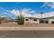 Charming single-story home with desert landscaping, clear blue skies, and mature cactus in the front yard at 8252 E Heatherbrae Ave, Scottsdale, AZ 85251
