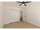 Bedroom features modern ceiling fan, spacious closet, and neutral decor at 862 W Javelina Ave, Mesa, AZ 85210