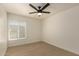 Bedroom with modern ceiling fan and large window providing natural light at 862 W Javelina Ave, Mesa, AZ 85210