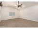 Empty bedroom featuring wood-style flooring, recessed lights, and a large window at 862 W Javelina Ave, Mesa, AZ 85210