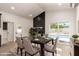 Formal dining room featuring a modern fireplace, sliding glass doors, and seating for six at 862 W Javelina Ave, Mesa, AZ 85210