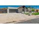 Charming single-Gathering home featuring a two-car garage, desert landscaping, and a well-maintained front yard at 862 W Javelina Ave, Mesa, AZ 85210