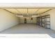 Spacious garage with ample storage racks and shelving, perfect for organization and vehicle parking at 862 W Javelina Ave, Mesa, AZ 85210